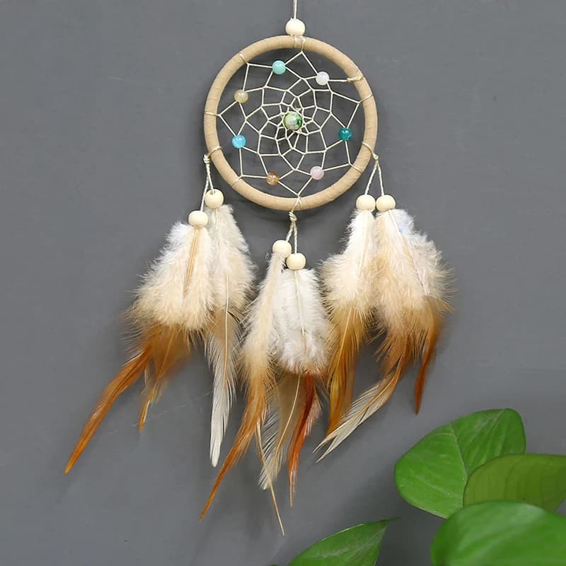 1pc Handcrafted dream catcher featuring rattan beads and feathers, perfect for wall decor and home ornamentation