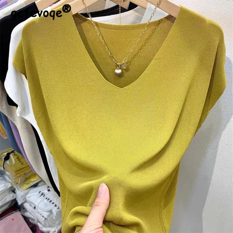 Abbigliamento donna estate moda semplice manica corta seta ghiaccio sottile t-shirt lavorata a maglia Casual pendolarismo solido scollo a V Pullover allentato top