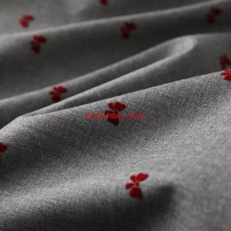 Tessuto floccato con nodo a farfalla rosso 3D per abito gonna a pieghe abbigliamento tessuto di design tessuto da cucito