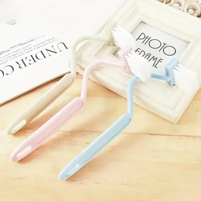 A Small Toilet Brush with a V-Shaped And S-Shaped Design, Featuring a Bent Handle for Sanitation. This Plastic Brush Is Ideal