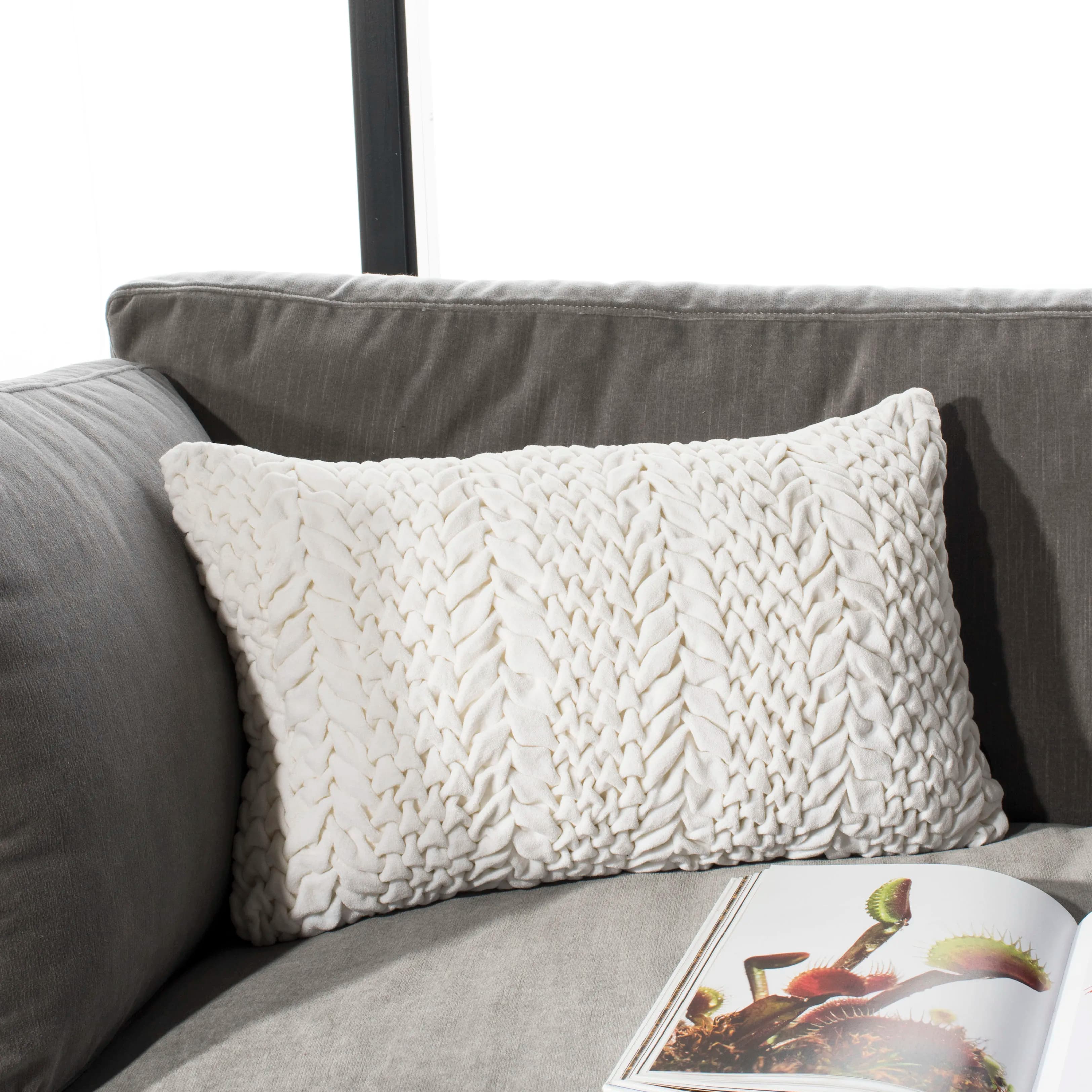 Solid plush pillow 12 inches by 20 inches in creamy tone