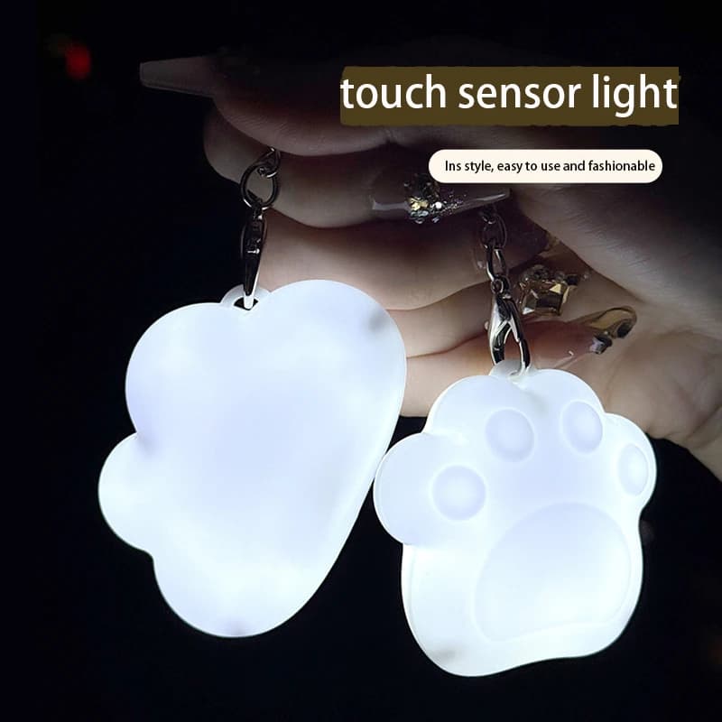 Lampada emettitore di luce con sensore tattile Borsa ricaricabile di tipo C Portachiavi Luce notturna Lampada con sensore a sospensione di bell'aspetto e pratica