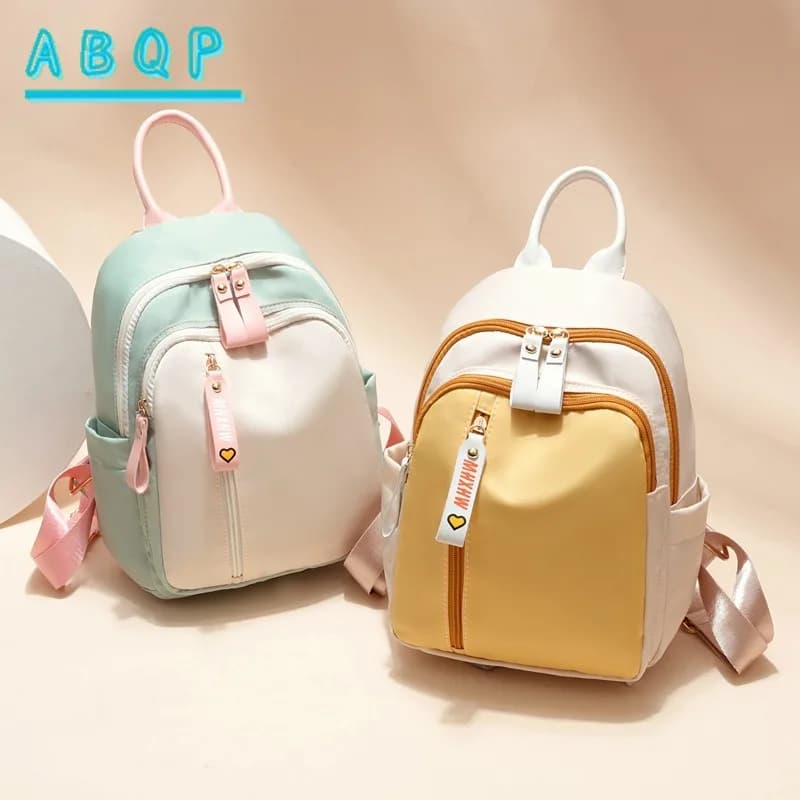 Women's casual backpack, adjustable strap, zip closure, nylon polyester lining, practical pockets, commuters' trips, travel