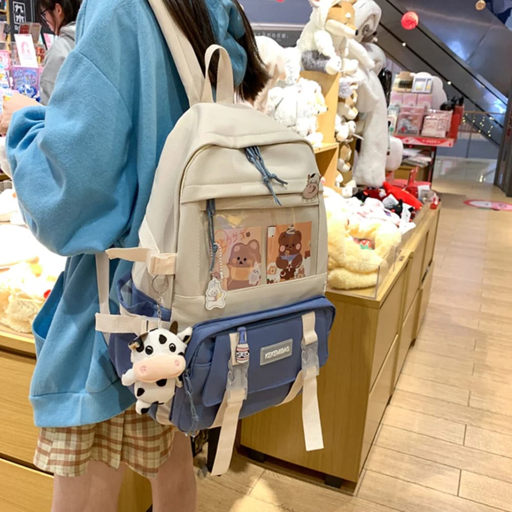 Zaino moda per ragazze da donnaZaini a colori contrastanti Zaini in tela per il tempo libero Zaino simpatico cartone animato con distintivo pendente