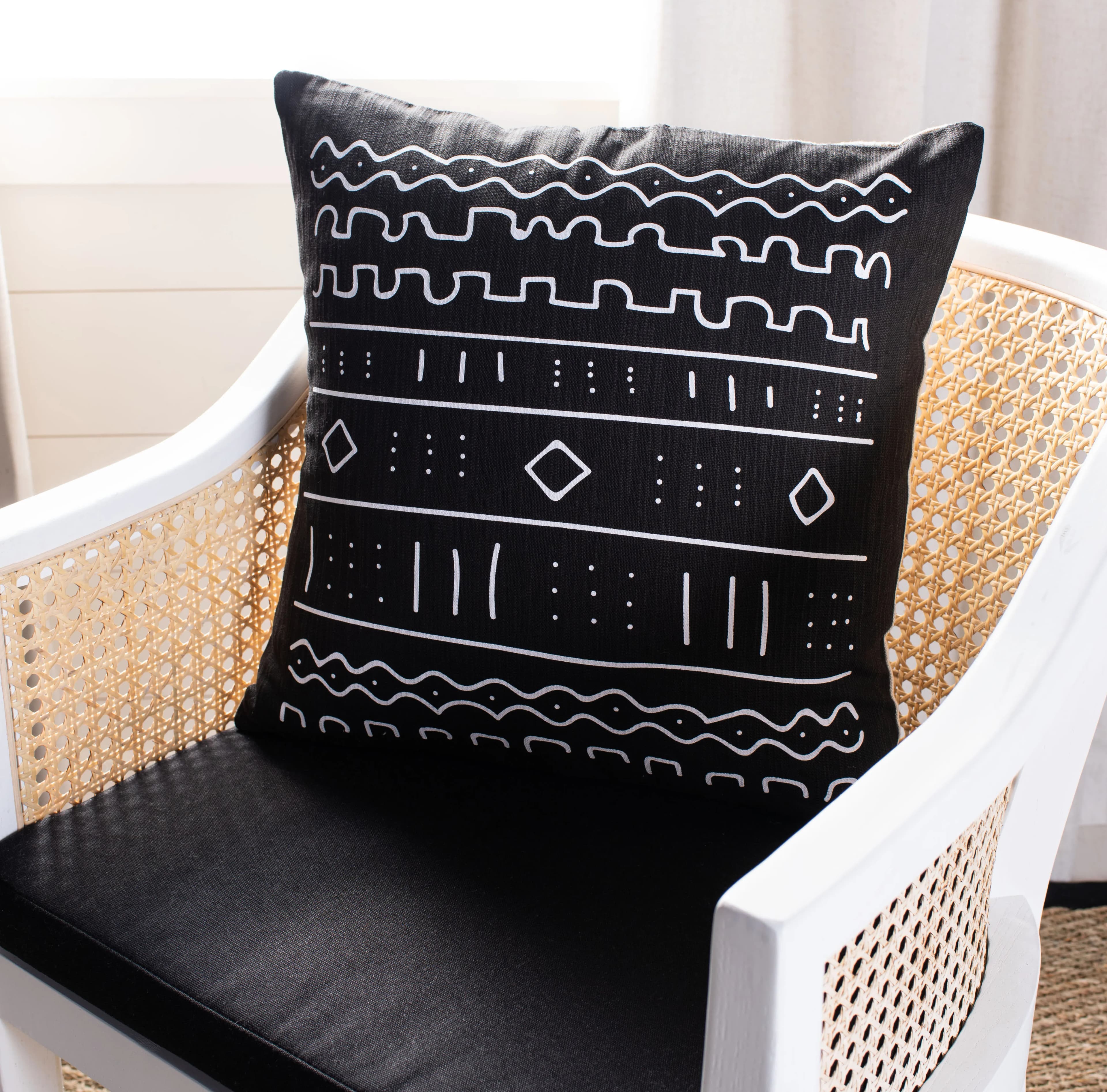 Southwestern-style plush pillow 18 inches square in black and white color scheme
