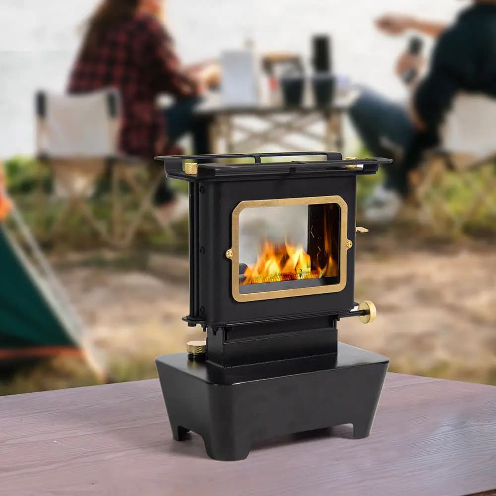 Portable camping stove with external heater for oil lamp