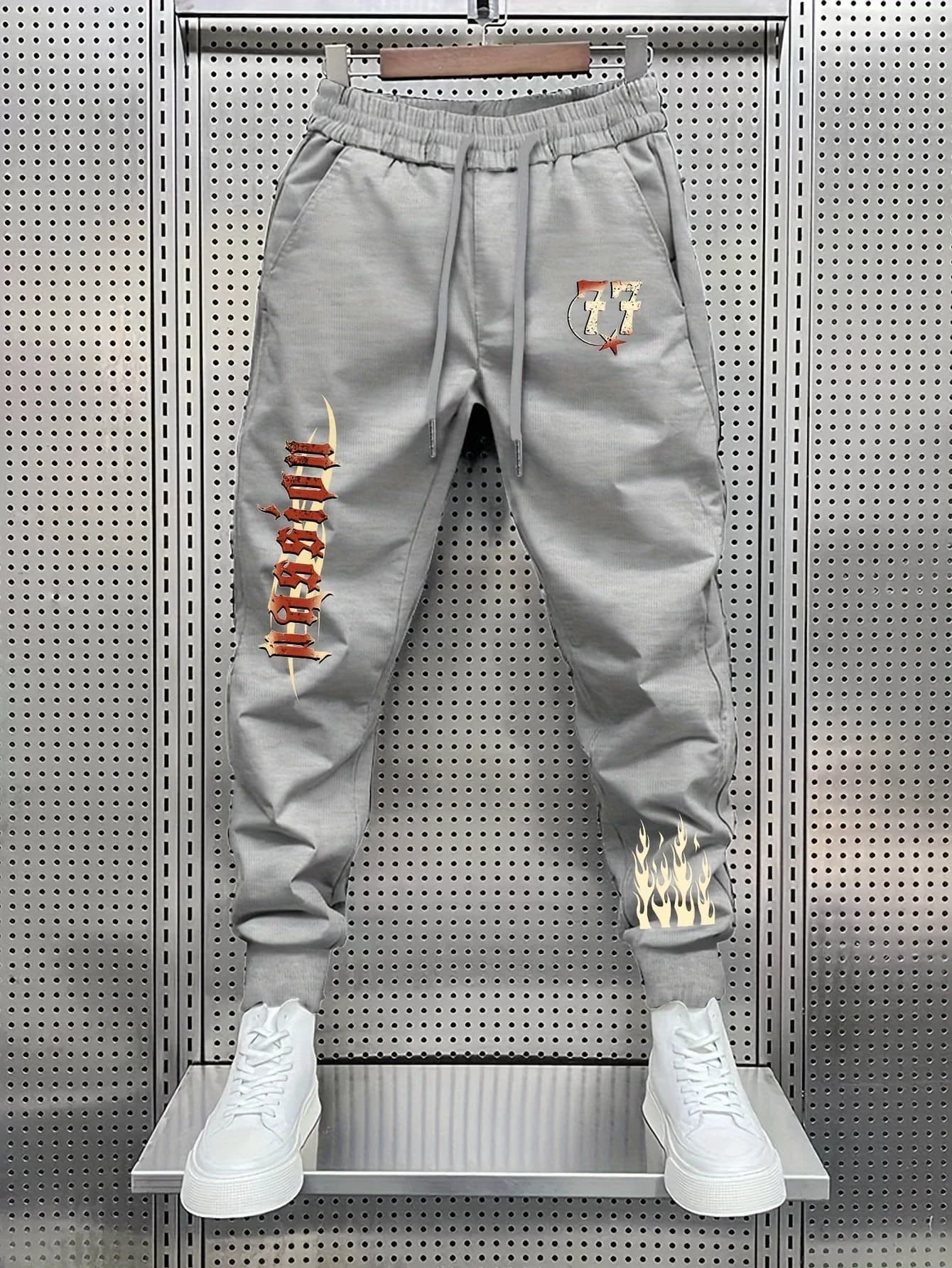 Hot street‑wear gothic lettering number77 burning flame side artwork print sweatpants men hip hop sports jogger trousers