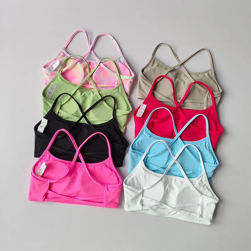 Lingerie sportiva incrociata sul retro Reggiseno fitness ad asciugatura rapida da donna con imbottitura sul petto Tuta da yoga sexy con reggicalze senza schienale