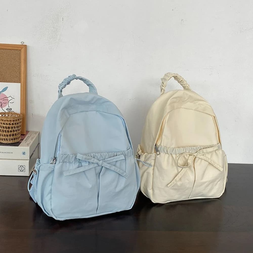 Zaino da donna in stile giapponese, borsa da studente alla moda leggera con fiocco, zaino da viaggio casual semplice in tinta unita per la scuola