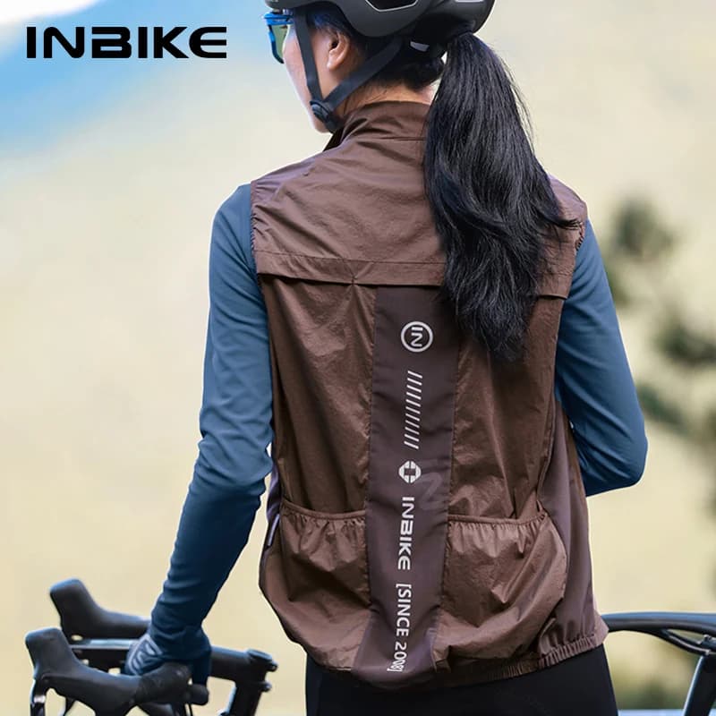 INBIKE Gilet da ciclismo da donna senza maniche Giacca antipioggia da corsa Abbigliamento da ciclismo MTB leggero Giacche a vento riflettenti con tasche
