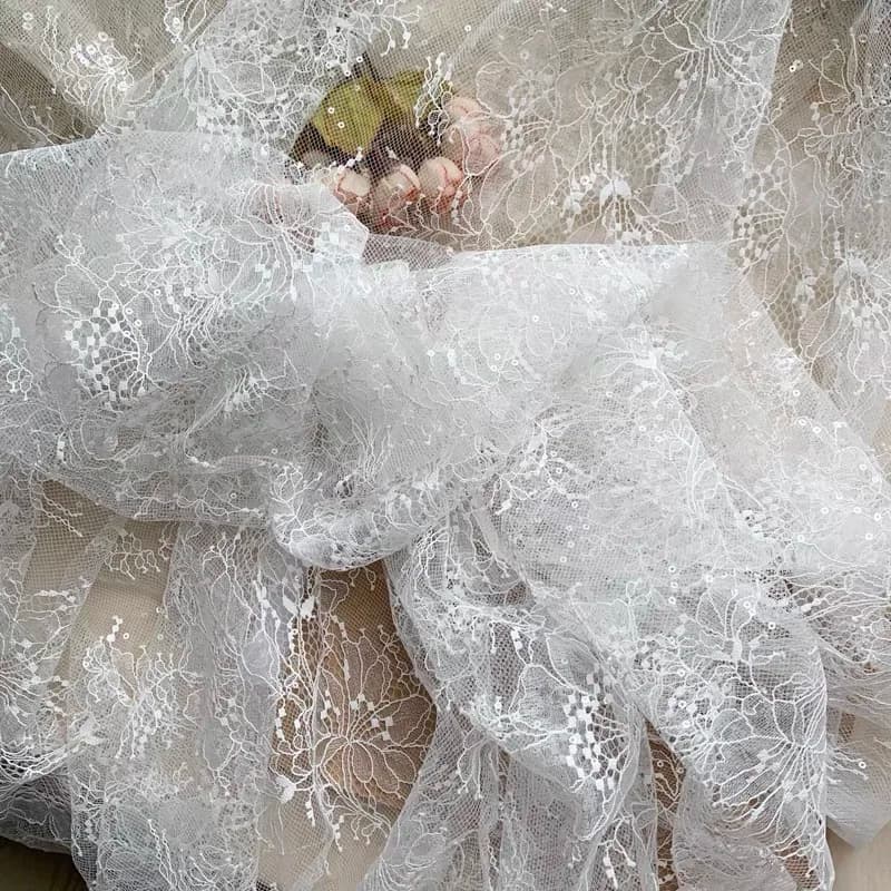 Pizzo con paillettes color avorio per abito da sposa, venduto a metraggio, bestseller 2026