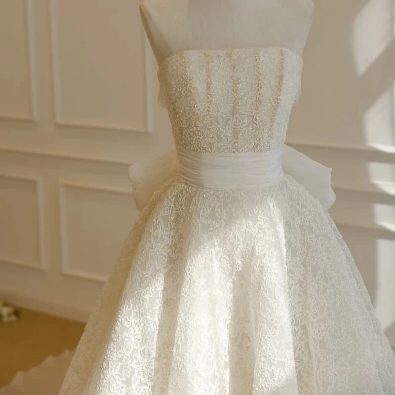 Abito da ballo bianco in raso personalizzato Abiti da sposa reali Pizzo Coda lunga Grande fiocco realizzato Robe De