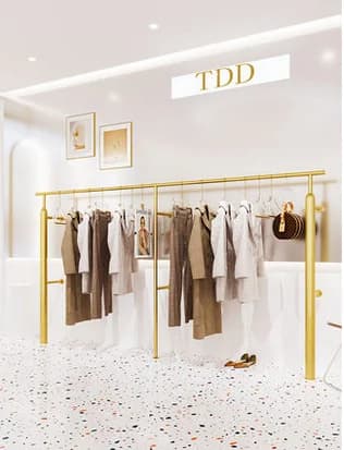Appendiabiti a parete negozio di abbigliamento da donna scaffale a parete espositore laterale dorato espositore per abbigliamento