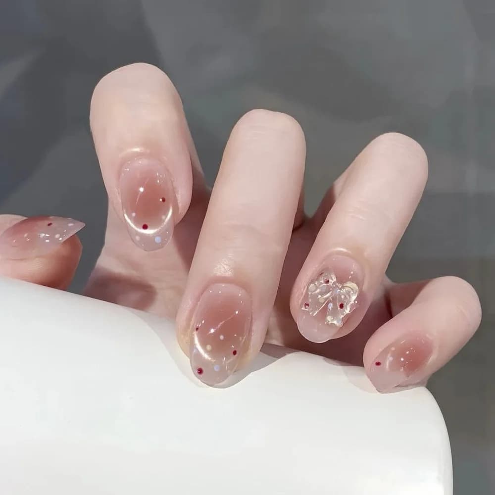 Nuova Collezione 2026: Nail Art Semplice Rosa Nude a Tre Colori con Pois, Effetto Occhio di Gatto Francese e Accessori Fiocco con Strass