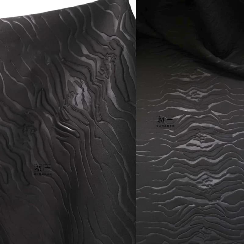 Tessuto a strati d'aria in rilievo con incisione laser nera Giacca a vento Cappotto Pantaloni Abito Abbigliamento Designer Materiale per cucire Panno all'ingrosso