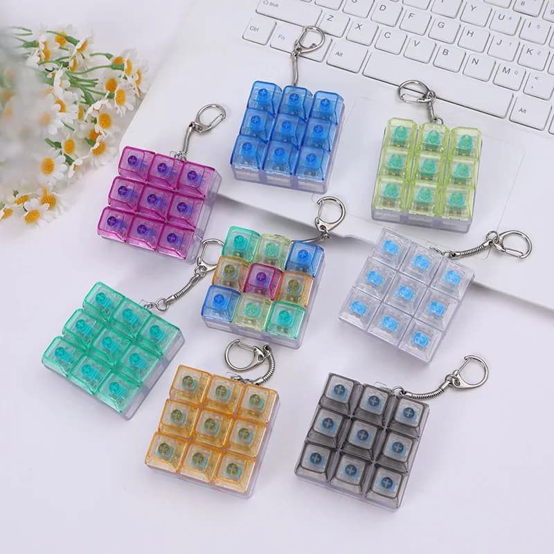 9 tasti pulsante dito tastiera meccanica copritasti portachiavi agitarsi giocattoli decompressione antistress tastiera clicker giocattolo per bambini
