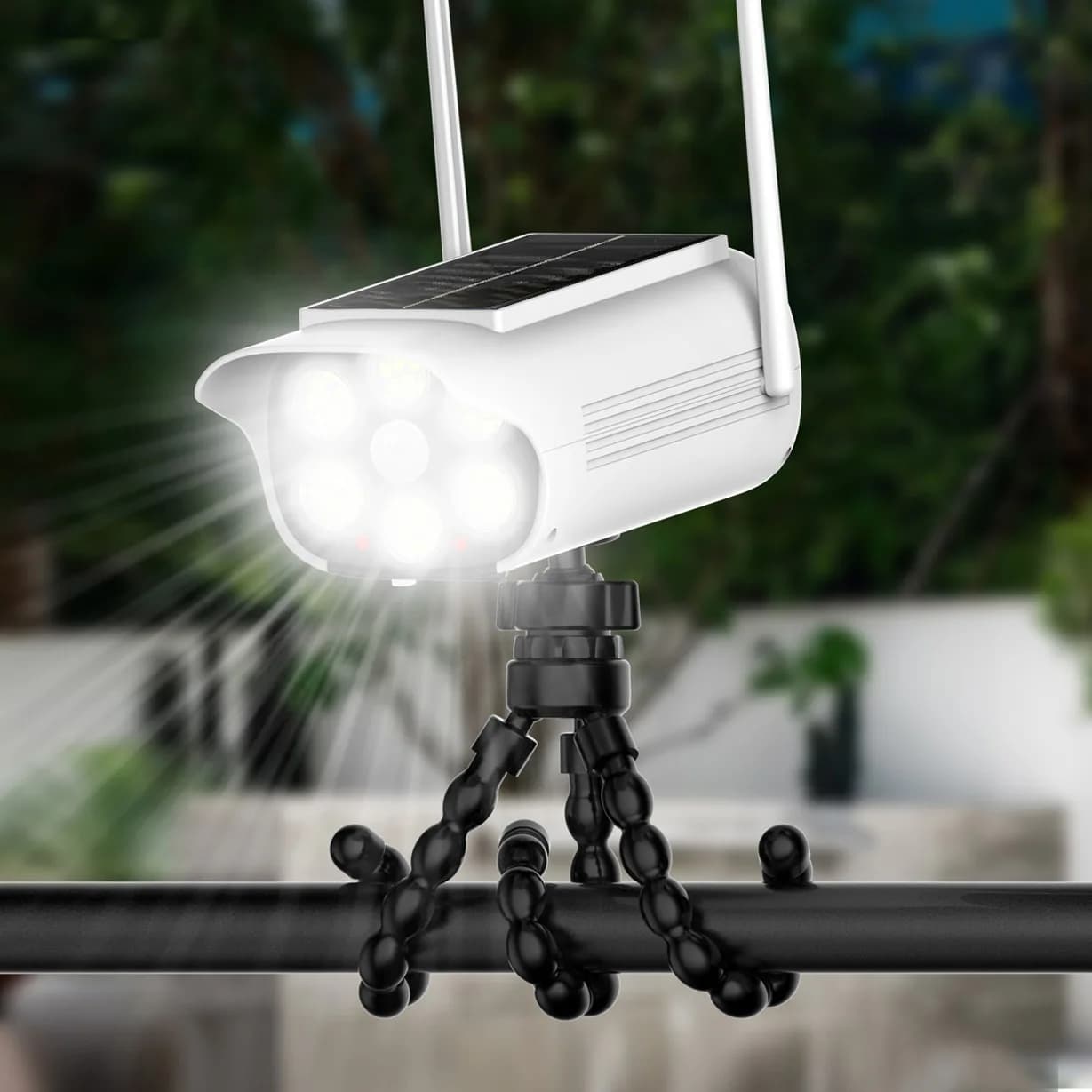 LED solar lamp with motion sensor, wireless anti-theft camera simulation, outdoor safety light.