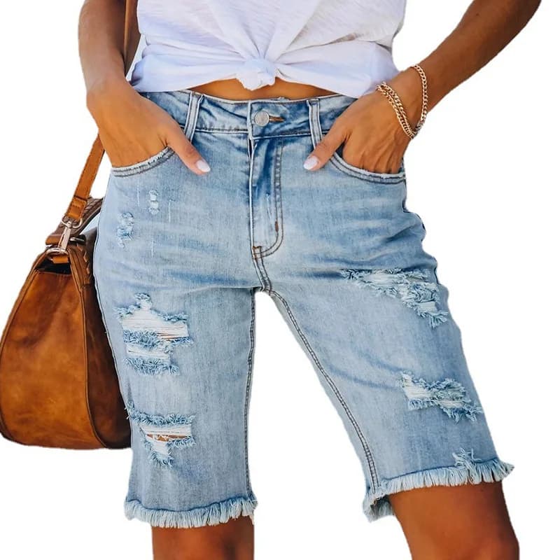 Pantaloni skinny elasticizzati con frange in stile streetwear estivo europeo e americano, jeans strappati a vita media per donna.