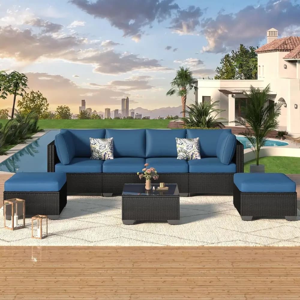 Set of 7-piece garden furniture with navy blue cushions, PE rattan sofa, modular chairs and tea table