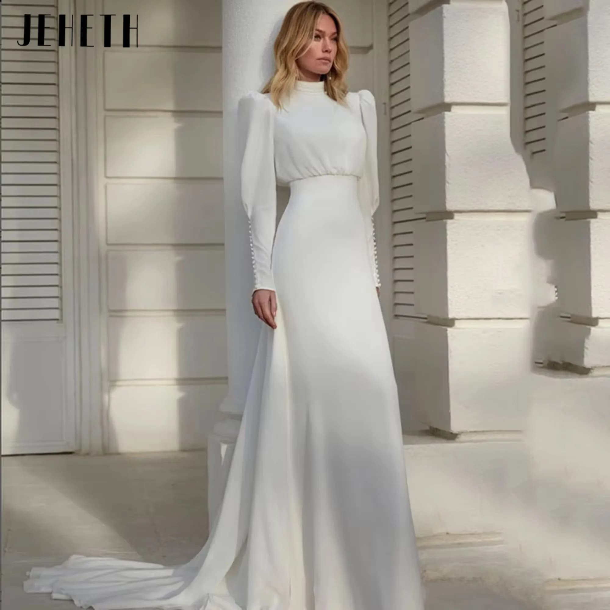 JEHETH Collo alto Abiti da sposa in chiffon bianco Donna Manica lunga a lanterna Pieghe Guaina Abito da sposa Bottone Sweep Train Personalizzato JEHETH alto collo bianco abiti da sposa in chiffon donne manica lunga lan