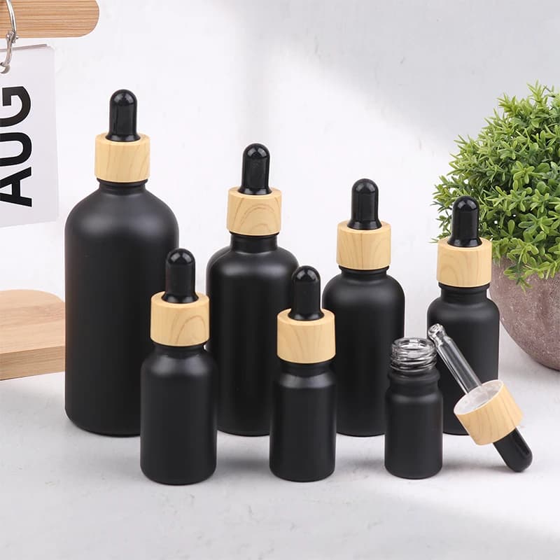 5ml-100ML Bottiglia di vetro per olio essenziale nero satinato Bottiglia contagocce per venature del legno Bottiglia per pipetta liquida per aromaterapia riutilizzabile