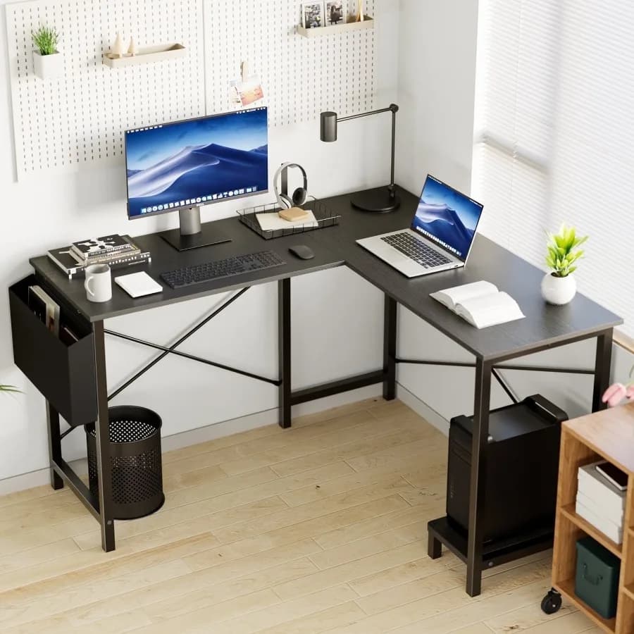 L shaped computer desk designed for gaming writing or studying in home offices and dorms; fures a sleek black finish ample work