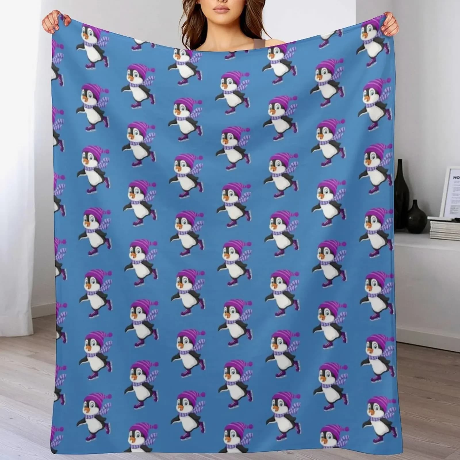 Coperta morbida e resistente riutilizzabile per tutte le stagioni, con simpatico pinguino che pattina sul ghiaccio e cappello viola.