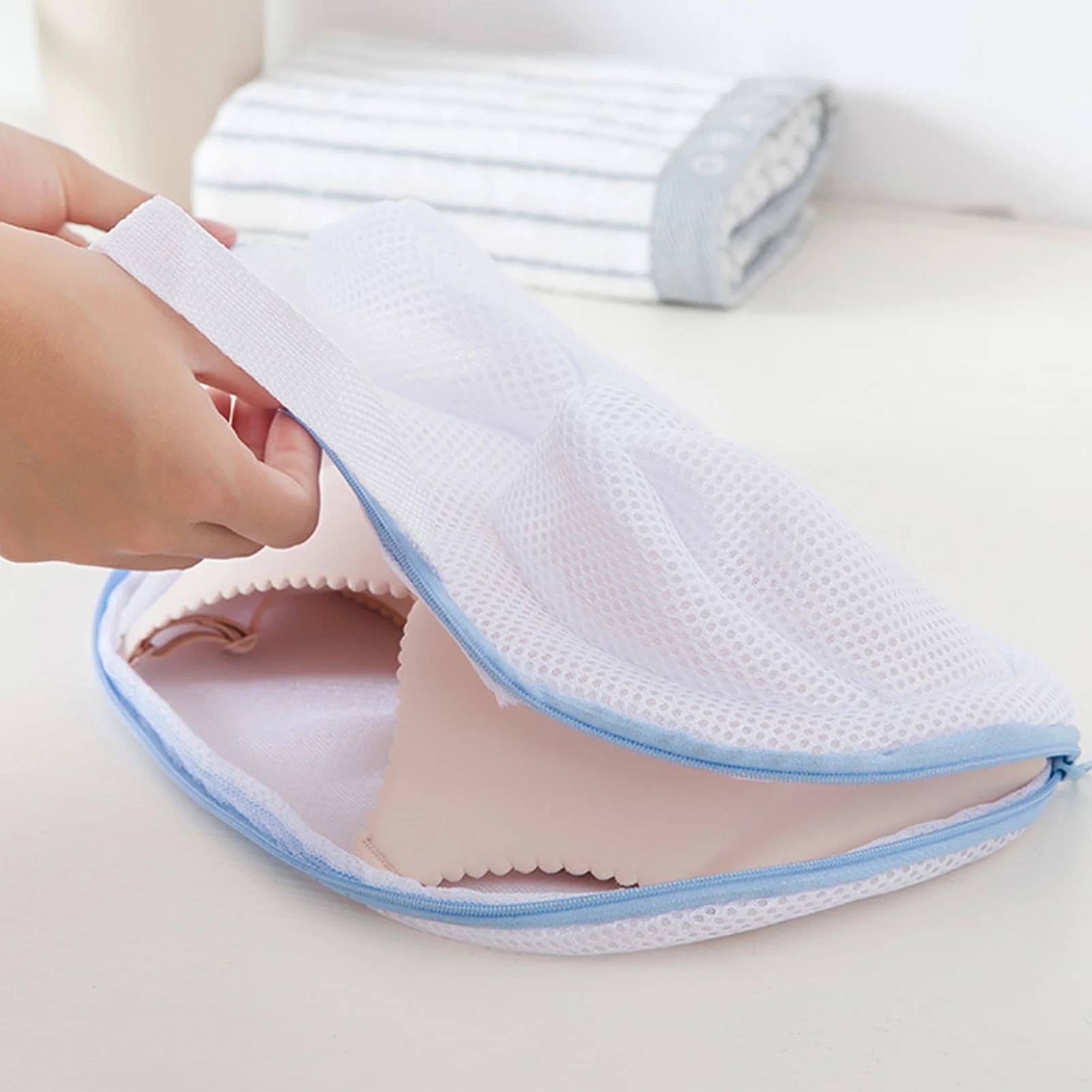 Washing machine underwear bag, made of durable polyester fabric with fine mesh design.