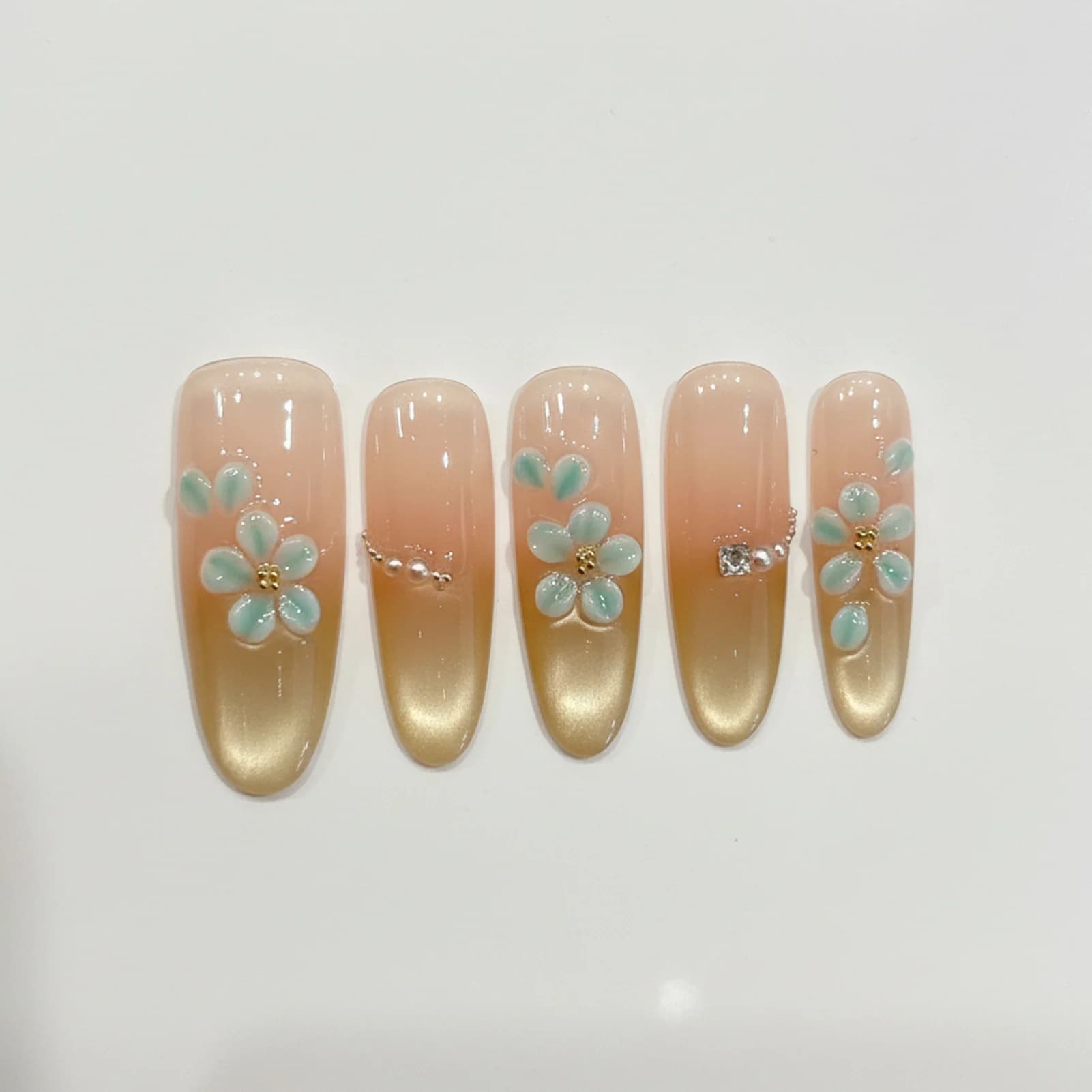 Handmade fake nails 10 pieces Artificial nails wearables Fake nails shaded in pink gold Drawings of green enamelled flowers Print on nails