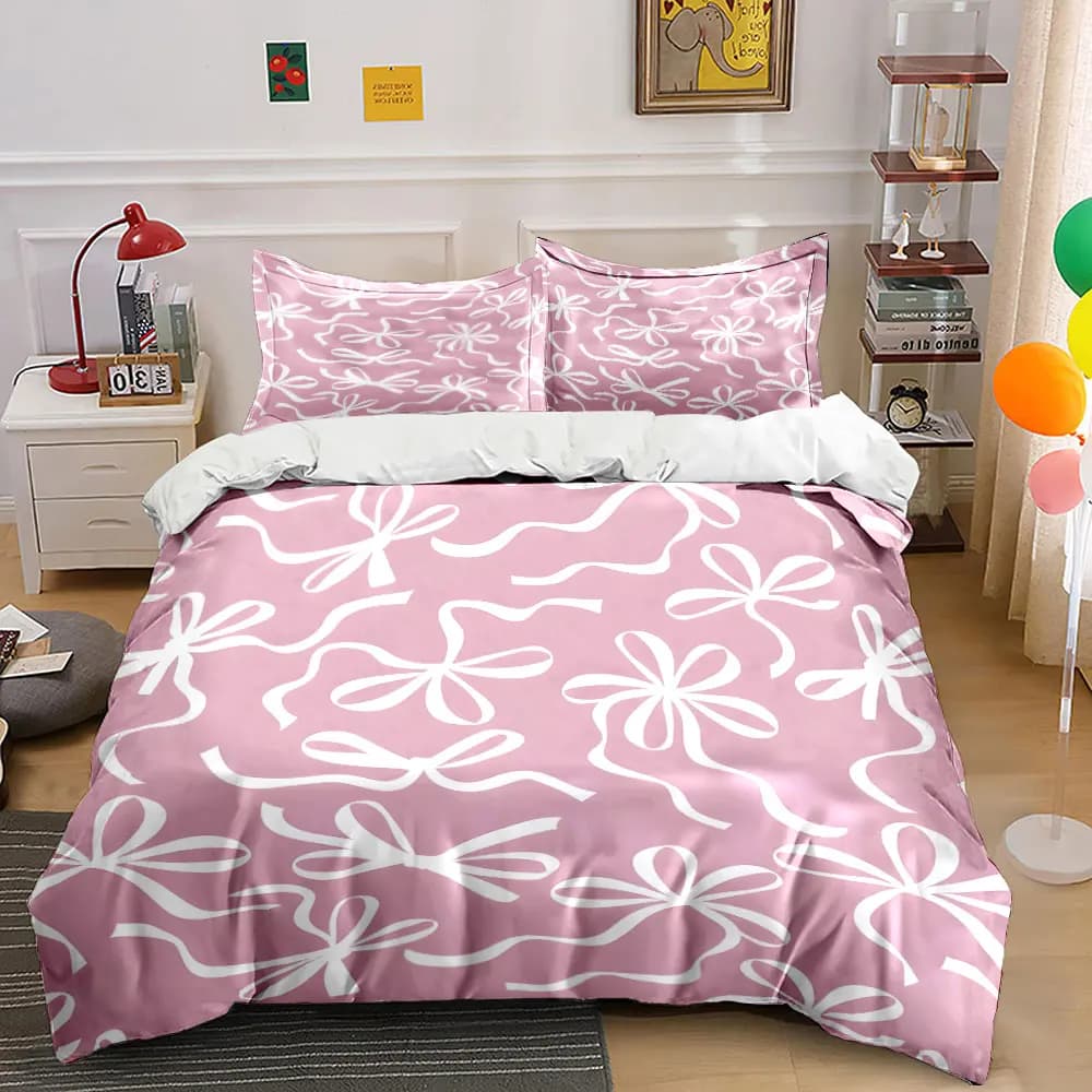 Fondo rosa con motivo a fiocco bianco. Set di biancheria da letto con copripiumino morbido e confortevole. Include 1 copripiumino e 2 federe.