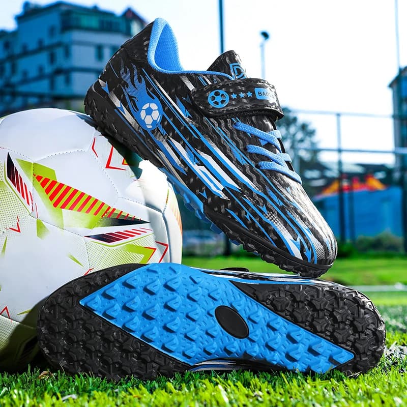 A pair of children low-top TF soccer cleats, black blue flame print, velcro strap anti-slip turf football shoes CT-186