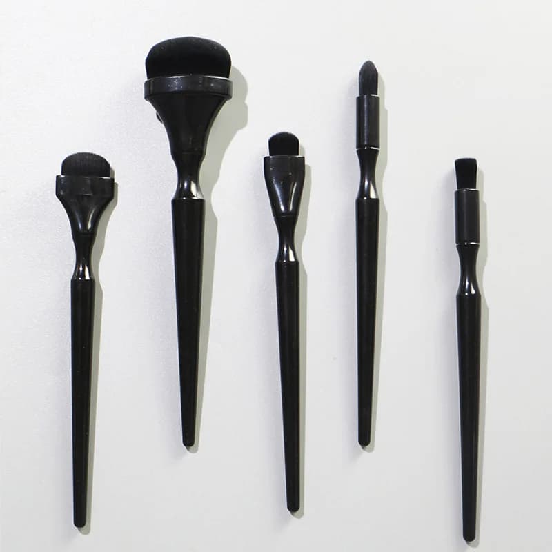 Set of practical and convenient black makeup brushes, foundation brushes, shadow and soft bristles powder, and beauty tools for makeup.