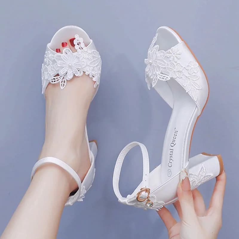 Women's wedding shoes with high heel in summer white silk with open tip and buckle strap