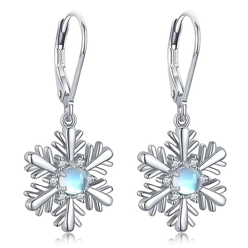 Orecchini pendenti con fiocco di neve di natale Huitan per le donne accessori in pietra di luna imitazione Color argento per regalo di gioielli invernali per feste