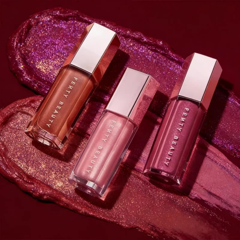 Fenty Beauty Illuminante Viso e Labbra, Gloss Volumizzante Glitterato, Rossetto Liquido Facile da Applicare, Olio per Trucco Labbra
