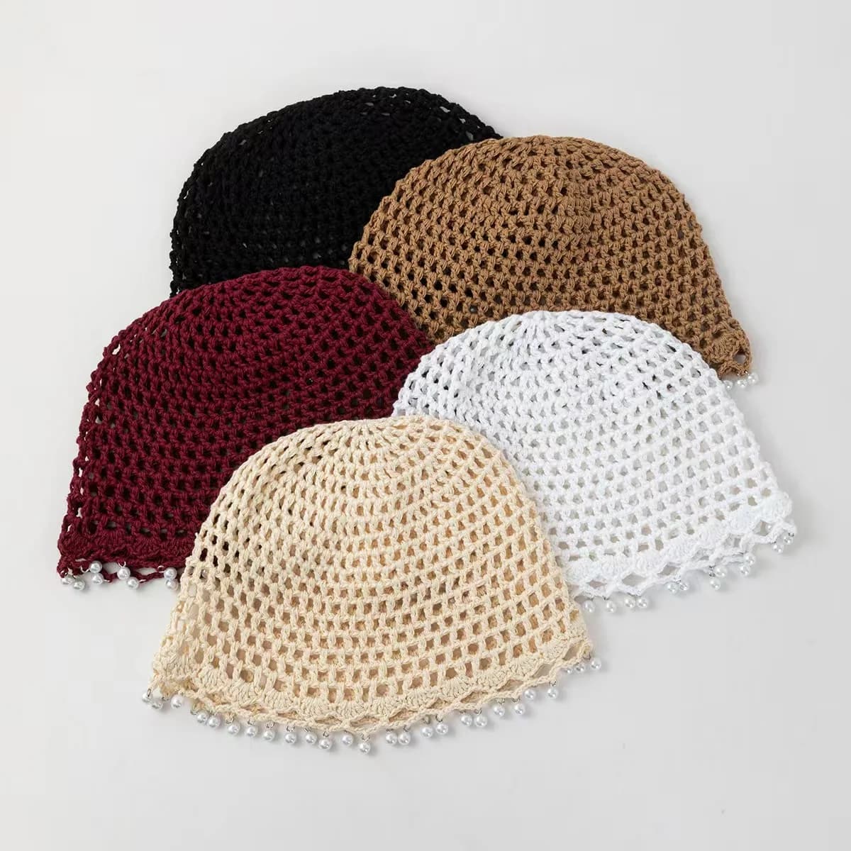 Lightweight, breathable, open-knit "water pearl" style beanie—an artistic, close-fitting knitted hat.
