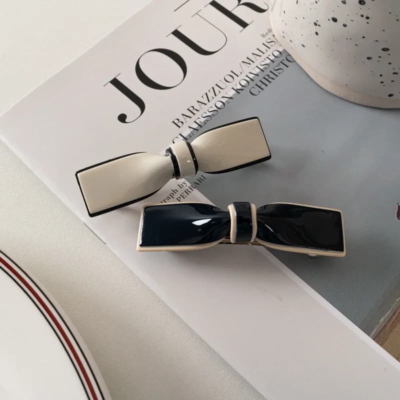 Minimalist bow hair clip - Glossy black resin clip and women's cream, perfect for everyday styling, office, appointments and updo.