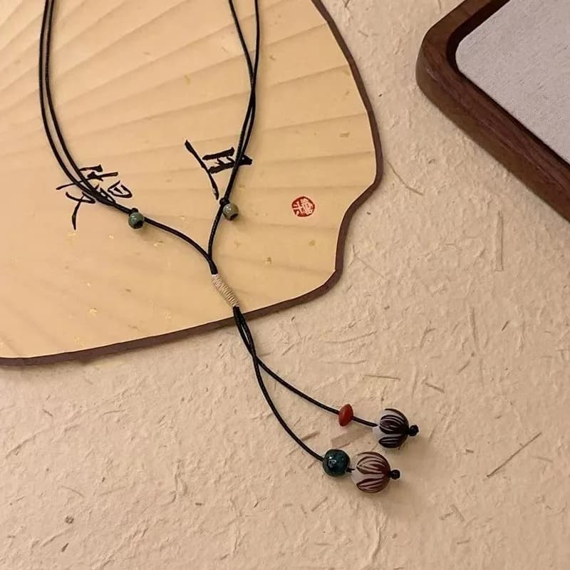 Collana con ciondolo di frutta secca intrecciata tibetana vintage ghianda per donna, design divertente, catena lunga maglione con nappa, catena della clavicola