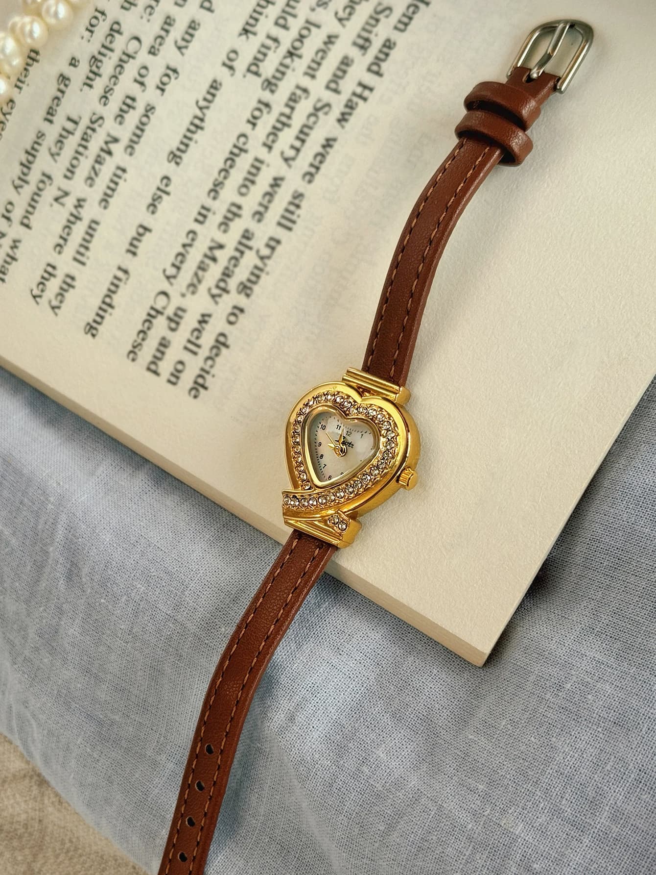 1 new elegant and refined quartz watch with brown leather strap studded with diamonds and heart-shaped dial.