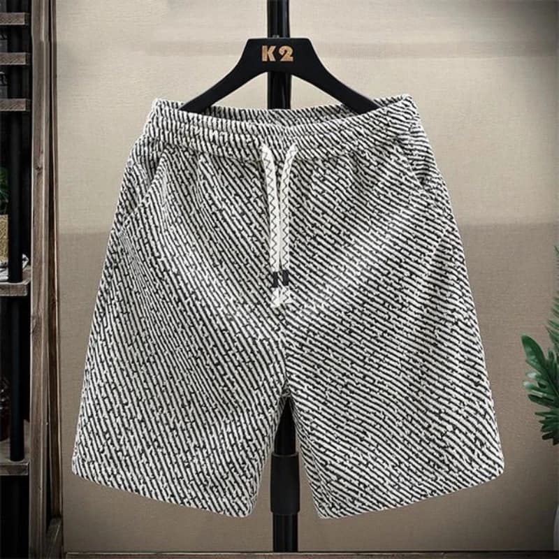 Pantaloncini da uomo per l'estate Lavaggio sottile Pantaloni versatili a cinque punti stile coreano Pantaloni sportivi casual lavorati a maglia alla moda