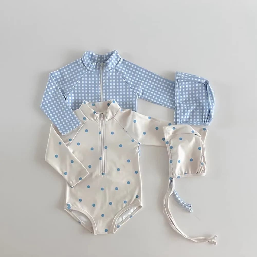 Nice full sleeve swimsuit with square print and polka dots, protective against the sun, with swim cap for babies and girls.