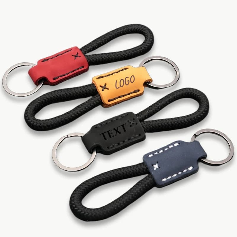 Custom LOGO Bag Genuine Leather Keyring Text with Laser Engraving Keyring with Drawstring Keyring with custom woven rope
