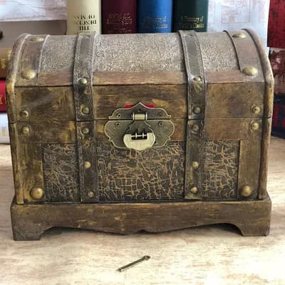 Antique and old, golden treasure chest, pirate box, wooden wooden box with lock, retro storage old storage box