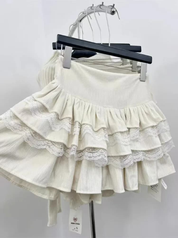 Minigonna estiva francese elegante patchwork Gonna dolce ragazza in velluto con bordo in pizzo cucito Gonna con bocciolo Design alla moda da donna Gonne con fiocco