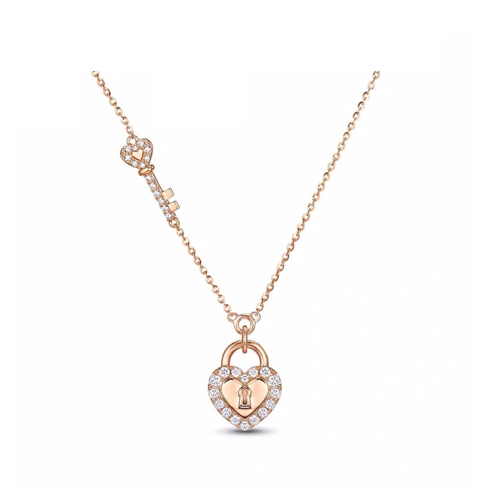 Collana con ciondolo a forma di cuore e chiave color oro rosa