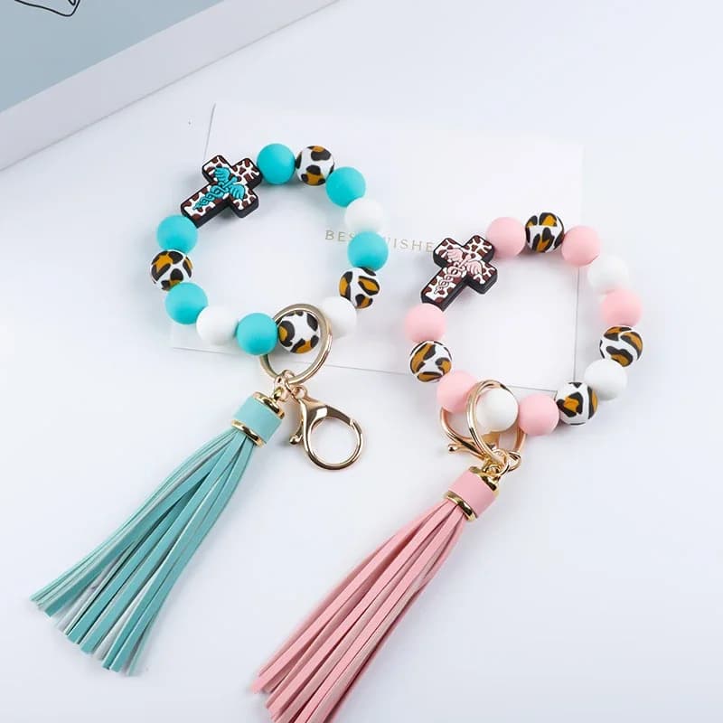 Portachiavi con perline, ciondolo da polso in silicone a forma di croce, elastico, con nappa, braccialetto portachiavi per auto, da donna