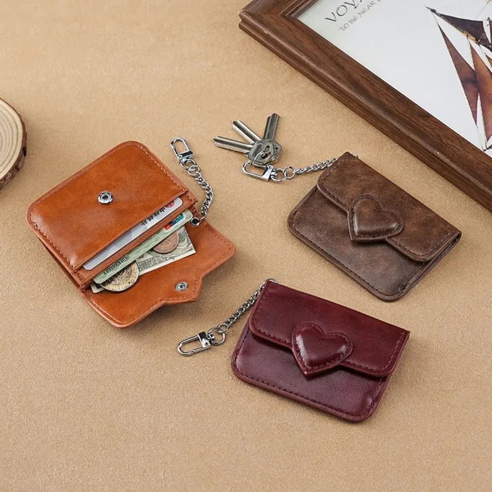 Porta carte da donna leggero in pelle PU Portafoglio piccolo a forma di cuore carino Porta carte multi-carta antimagnetico Portamonete da viaggio