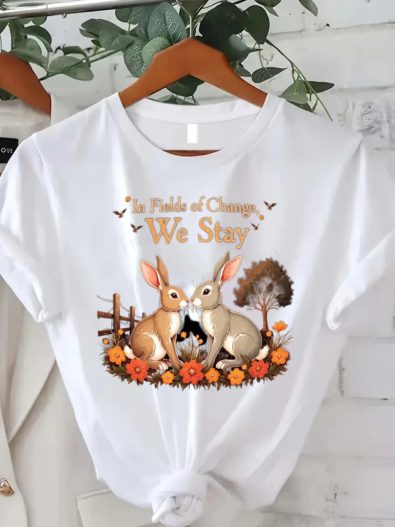 Comfortable T-shirt with women's print T-shirt with pair of cute bunnies "In Fields of Change, We Stay" Autumn floral design