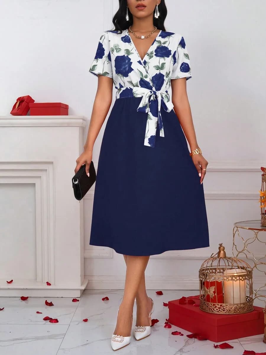 Floral blue woman dress with V neckline, short sleeves, wrapping pattern with belt, A line, midi length for spring summer