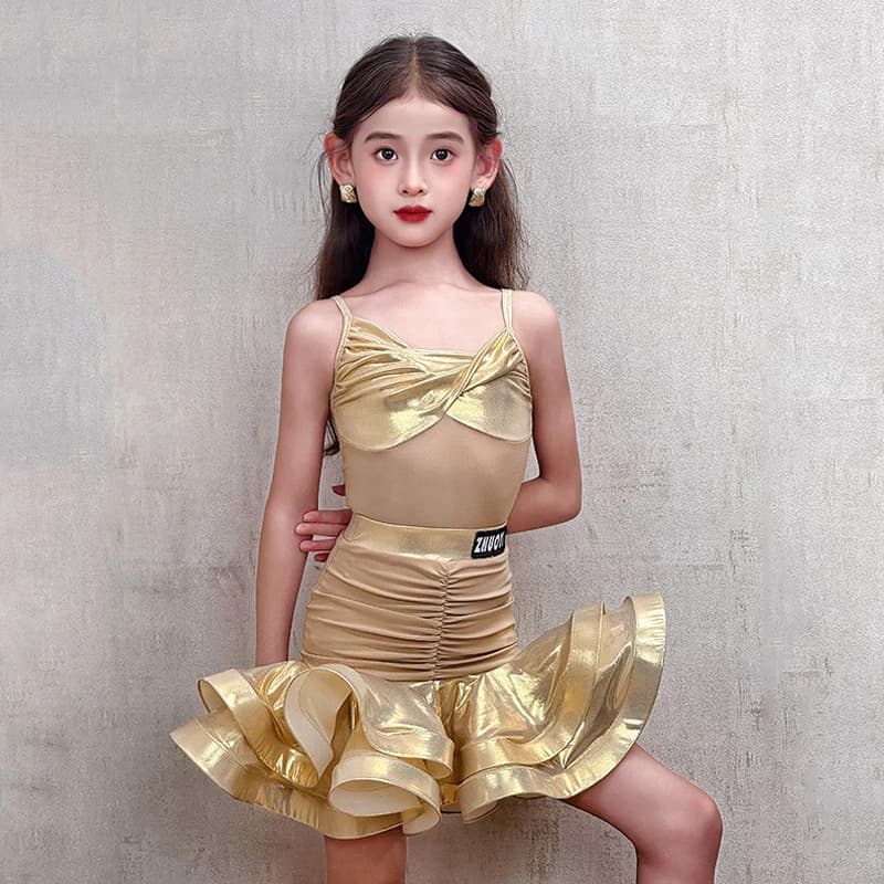 2026 Vestito da ballo latino Kid Oro Vestito da spettacolo di danza Tuta senza maniche Gonna a balze Ragazze Vestito latino professionale VDL5019